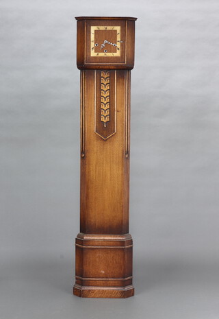 A 1930's Art Deco Enfield 8 day striking on gong, triangular shaped longcase clock, the 15cm square dial with Roman numerals, contained in an oak case 145cm h x 32cm w x 23cm d 