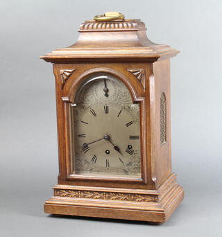 Kienzle, a Continental 8 day striking bracket clock with 17cm arched silvered dial contained in an oak case, striking on 5 gongs, the back plate marked Kienzle 34574, complete with pendulum (no key and key to front door missing) 45cm h x 27cm w x 19cm 