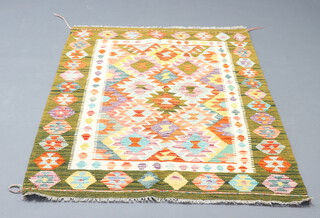 A yellow, green and white ground Chobi Kilim rug with all over geometric designs 152cm x 109cm 
