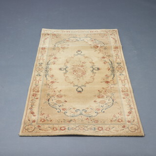 An Abbey cream ground and floral patterned Aubusson style hearth rug 160cm x 84cm
