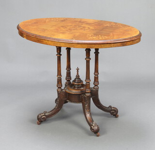 A Victorian oval quarter veneered inlaid walnut occasional table raised on a turned column and outswept supports 70cm h x 87cm w x 54cm d 