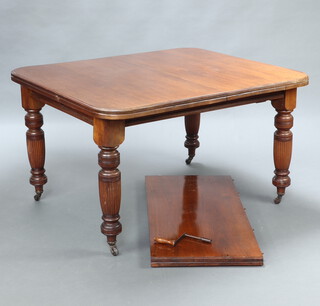 A Victorian mahogany extending dining table raised on turned and reeded supports with 1 extra leaf and winder 73cm h x 114cm w x 126cm l x 176cm l when extended 