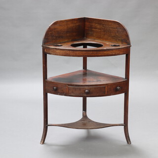 A Georgian mahogany corner wash stand with raised back fitted 3 bowl recepticals the base fitted a drawer with shaped undertier, raised on outswept supports 105cm h x 74cm w x 52cm d 
