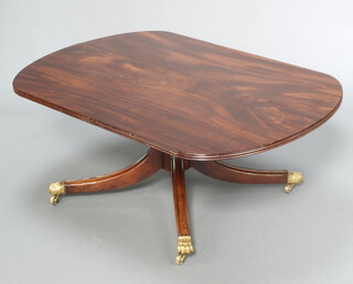 A Georgian style mahogany coffee table, raised on a turned column and tripod base ending in brass caps and casters 48cm h x 120cm w x 84cm d 