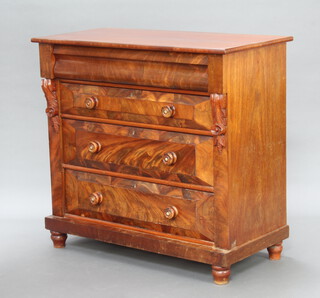 A Victorian mahogany Cumberland chest fitted a secret drawer with scrolls to the side above 3 long drawers, raised on turned supports 101cm h x 108cm w x 53cm d 