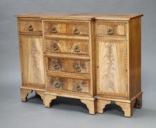 A Georgian style crossbanded bleached mahogany breakfront sideboard fitted four long and 2 short drawers flanked by cupboards, raised on bracket feet 76cm h x 103cm w x 32cm d 
