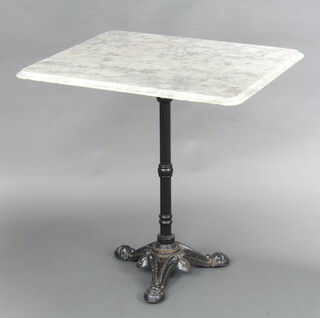 An iron and marble Bistro style table raised on shaped supports 74cm h x 65cm w x 75cm d (scratching to top and chip to edge) 