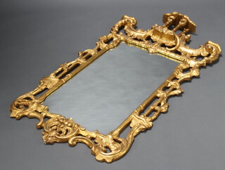 A Chippendale style rectangular plate wall mirror contained in a decorative gilt frame 148cm h x 74cm 