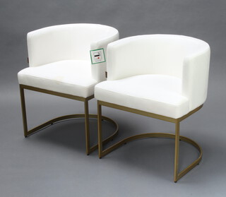 A pair of Art deco style Pure White Lines gilt metal tub back armchairs upholstered in white material 73cm h x 59cm w x 59cm d (seats 42cm x 40cm, one chair has a slight stain)
