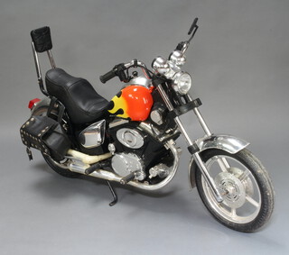 A child's electrically powered model Harley Davidson motorbike 69cm x 130cm x 23cm  