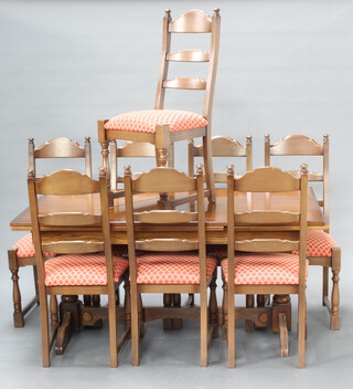 An oak dining suite comprising refectory style drawleaf dining table raised on turned supports with H framed stretcher 75cm h x 160cm l x 90cm w together with a set of 8 ladder back dining chairs with upholstered seats, raised on turned and block supports 107cm h x 47cm w x 44cm d (seat 24cm x 27cm) 