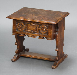 A rectangular carved oak hall/occasional table with hinged lid raised on standard end supports with H framed stretcher 47cm h x 52cm w x 35cm d (contact and water marks)  