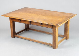 A rectangular oak coffee table fitted 2 drawers, raised on square supports 47cm d x 120cm w x 72cm d (some contact marks and damage to the front drawers) 
