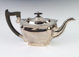 An octagonal silver teapot with ebony mounts, gross weight 704 grams, Sheffield 1921 