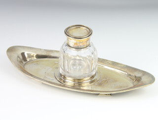 An Edwardian silver elliptical ink stand with silver mounted cut glass inkwell Sheffield 1903 24cm 