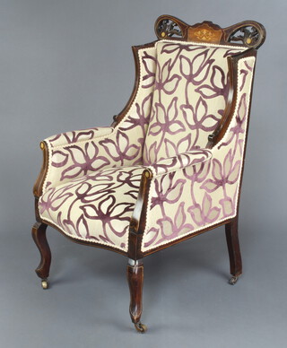 An Edwardian Art Nouveau inlaid mahogany show frame armchair upholstered in sculpted material, raised on cabriole supports 104cm h x 65cm w x 60cm d (seat 31cm x 39cm) 