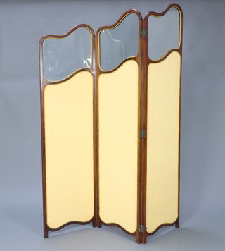 An Edwardian shaped mahogany framed 3 fold draft screen, with glass and yellow coloured fabric 176cm h x 45cm when closed x 135cm when open 