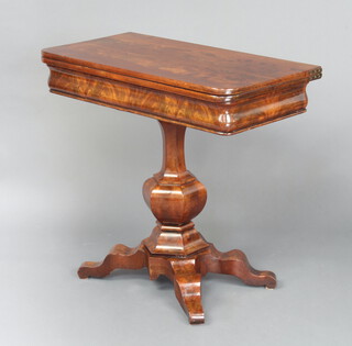 A Continental mahogany D shaped card table raised on a turned column and triform base 77cm h x 86cm w x 42cm d 