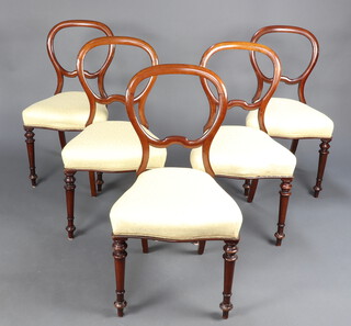 A set of 5 Victorian mahogany balloon back dining chairs with shaped mid rails and overstuffed seats, raised on turned supports 86cm h x 46cm w x 40cm d (seat 30cm x 25cm) 