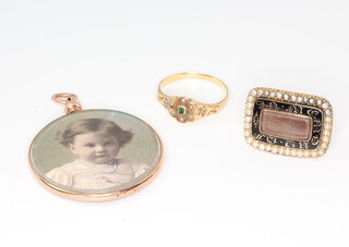 A 19th Century yellow metal, enamelled and seed pearl memoriam brooch, a gem set ring and a 9ct double sided pendant 