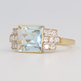 A yellow metal square cut aquamarine and diamond ring, centre stone approx. 1.8ct, the 14 brilliant cut diamonds 0.25ct, 3.2 grams, size m