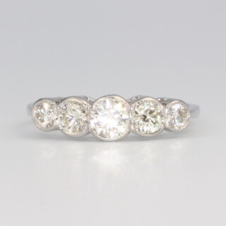 A white metal stamped plat 5 stone graduated diamond ring approx. 1.0ct, 3.5 grams, size M 