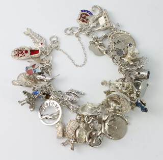 A silver charm bracelet 98 grams 