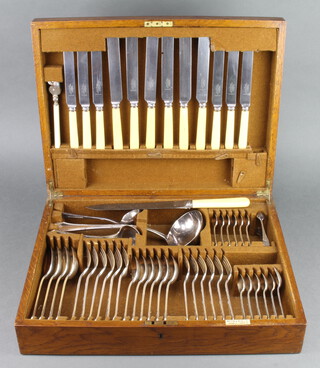 A canteen of silver plated Mappin & Webb cutlery for 6 contained in an oak canteen 
38 pieces plus 12 knives and a carver and sharpener