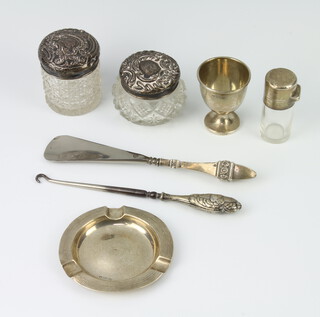 An Edwardian silver mounted glass scent rubbed marks, an egg cup, ashtray and 2 lidded jars, weighable silver 84 grams 