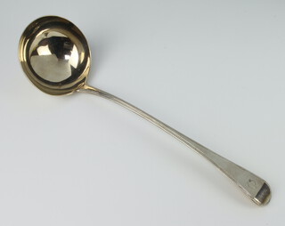 A George III silver Old English pattern ladle with bright cut decoration and crest London 1806, 200 grams 