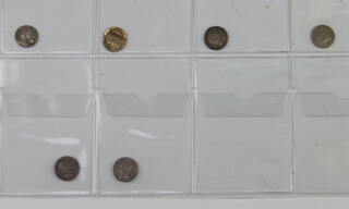 A Queen Anne penny 1710 holed, a George III penny 1776, 1786 and an 1800 penny, a William 1 1/2 pence 1834, Victoria ditto 1843 