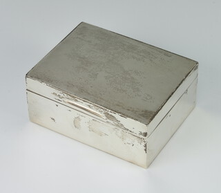 A rectangular silver engine turned cigarette box 11cm x 5cm 