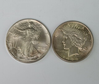 Two silver dollars 1922 and 1995 