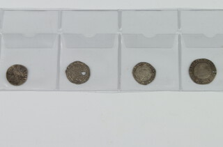 An Edward I silver penny, a Henry VI half groat (holed), an Elizabeth I threepence  1575 and a James I half groat second coinage (holed)