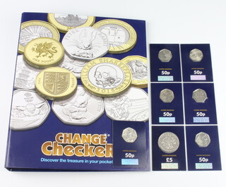 A Change Chequer album of 26 ten pence coins, 6 fifty pence pieces and a five pound coin 