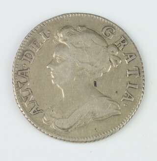 A Queen Anne shilling plumes in angles third bust 1708 