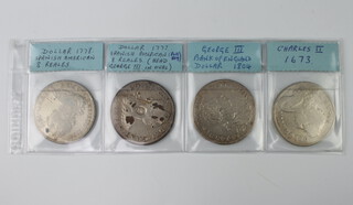 A Spanish American eight reales (holed) 1778, a 1777 copy, a George III Bank of England dollar 1804 and a Charles II crown 1673 