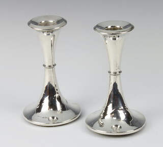 A pair of Edwardian silver candlesticks of waisted form 15cm, Birmingham 1909 