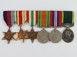 A World War Two medal group comprising 1939-45 Africa and Italy Star, Defence Medal, War medal and Territorial Efficiency Medal (militia) to 2338808 S1 GMN SJ Harrison R Signal 