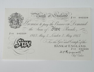 A Bank of England five pound bank note no.J11042229, dated 1945 