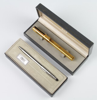 A gentleman's gilt Dunhill fountain pen with an 18ct nib boxed, together with a Cross ball point pen