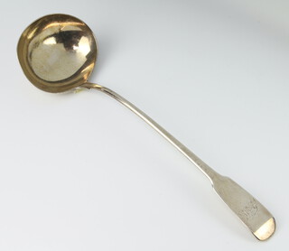 A George III silver fiddle pattern ladle with engraved monogram London 1813, 188 grams 