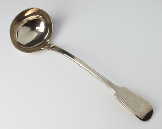 A Victorian silver ladle of fiddle pattern form with engraved crest London 1865, 314 grams 