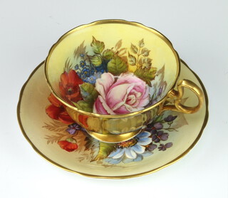 A rare Aynsley teacup and saucer decorated with Roses by Joseph A Bailey (active 1937-1974) the cup with gilt exterior the saucer marked C.804 the cup marked with 4 dots   PLEASE NOTE - VIEWING OF THIS LOT IS BY PRE-BOOKED APPOINTMENT ONLY 