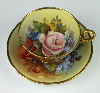 A rare Aynsley teacup and saucer decorated with Roses by Joseph A Bailey (active 1937-1974) the cup with gilt exterior the saucer marked 802 with 4 dots the cup marked with a cross   PLEASE NOTE - VIEWING OF THIS LOT IS BY PRE-BOOKED APPOINTMENT ONLY 