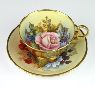 A rare Aynsley teacup and saucer decorated with Roses by Joseph A Bailey (active 1937-1974) the cup with gilt exterior the saucer marked C804 L the cup marked C804 and 4 dots  PLEASE NOTE - VIEWING OF THIS LOT IS BY PRE-BOOKED APPOINTMENT ONLY 