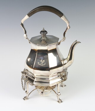 A Victorian octagonal silver plated tea kettle on stand with burner, ebony mounts and crest 