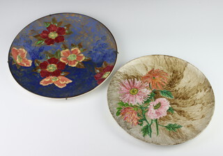 A Royal Doulton charger decorated with flowers 34cm and one other decorated chrysanthemums, the reverse with Art Pottery Exhibition label 1882 30cm 