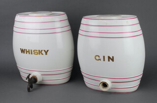 A ceramic Whisky barrel and cover (chipped and cracked) together with a Gin ditto (lacking spout and cracked) 34cm  