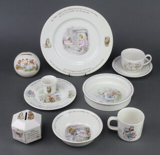 A Royal Doulton Bunnykins money bank 8cm, a Wedgwood Mrs Tiggy Winkle babies bowl, ditto dinner plate, side plate, tea cup and saucer, 2 mugs, an egg cup, dessert bowl and money bank (stuck) 